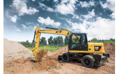 Аренда колесного экскаватора Caterpillar M317D2 с грейфером